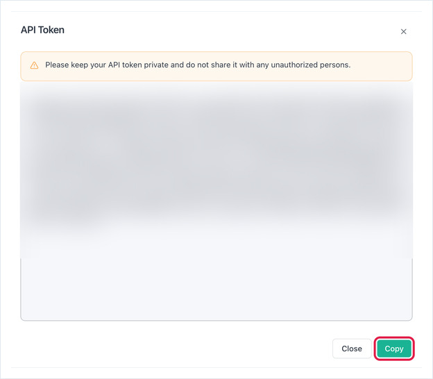 API Token dialog showing the generated token (blurred) with a Copy button