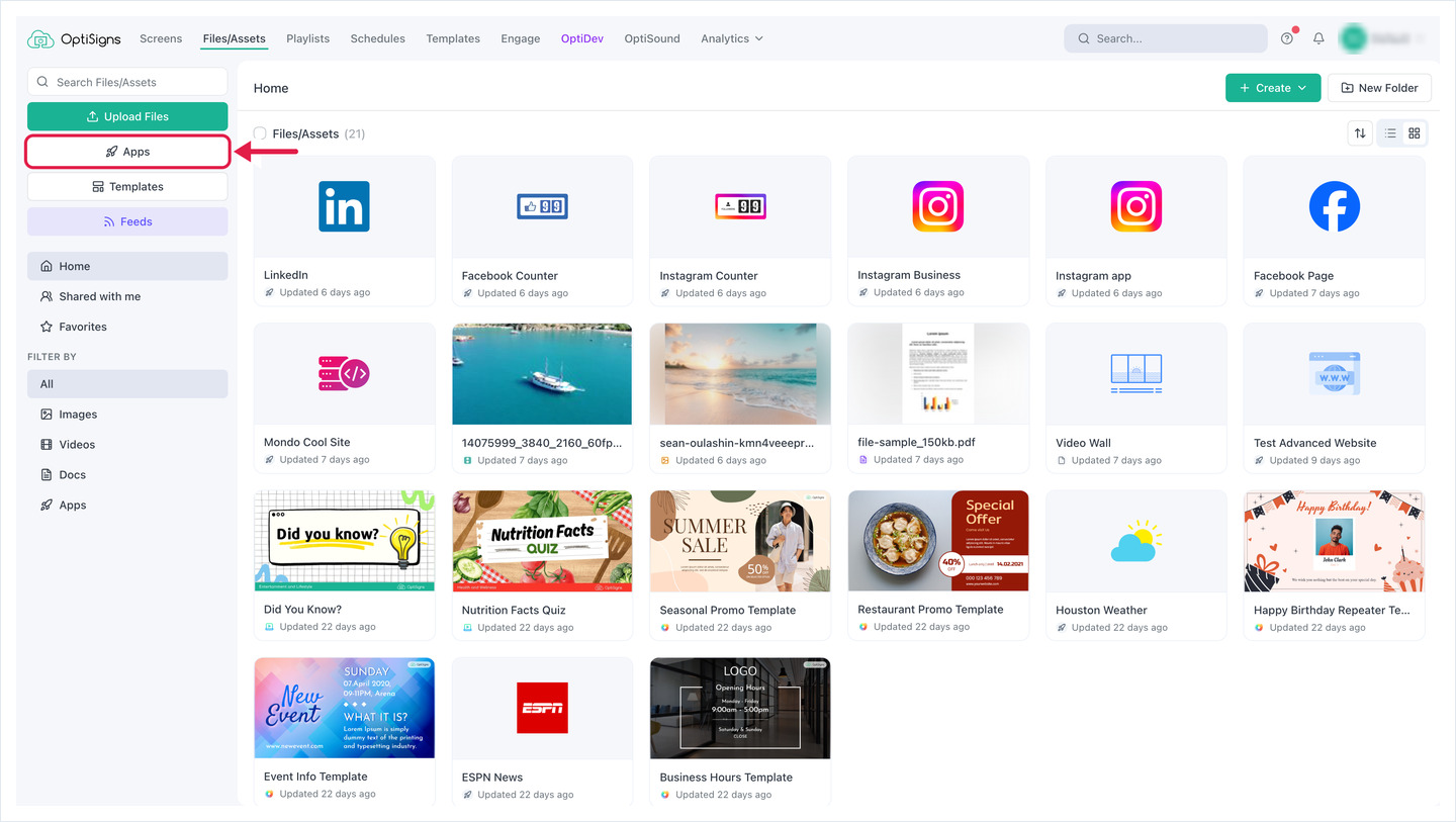 De pagina Bestanden/Activa van OptiSigns, met een pijl naar de knop Apps in het linkerpaneel.
