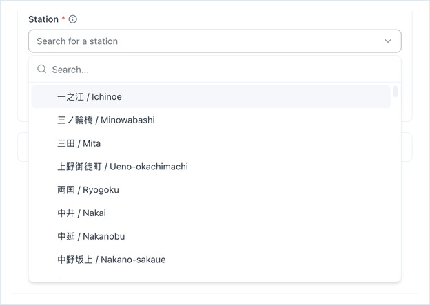 Station picker open, listing Toei stations in Japanese and English with a search box
